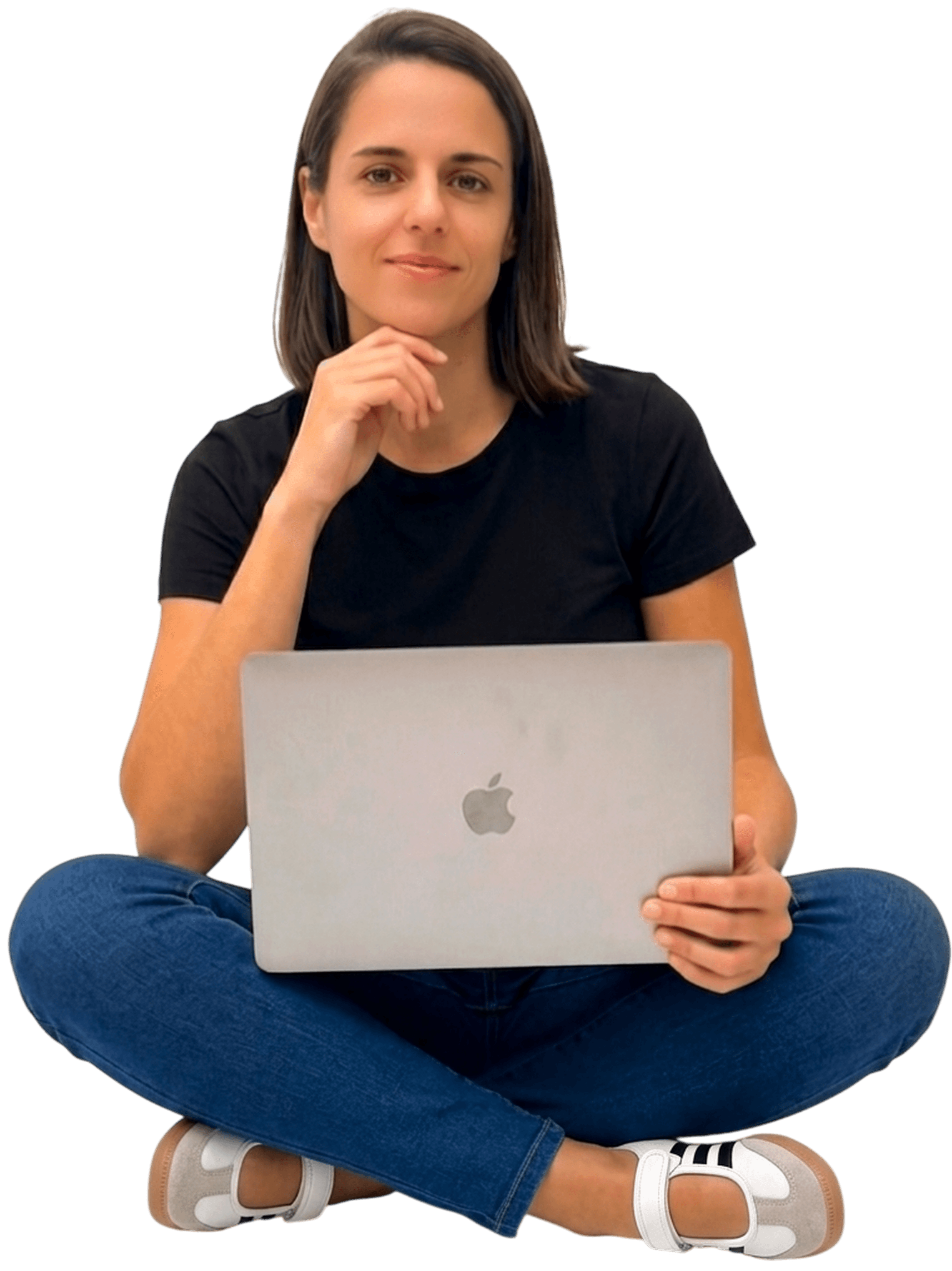 Camille, native French teacher, sitting cross-legged with her laptop